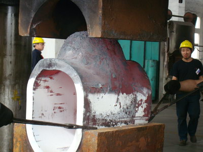 Hot forming a large butt-weld tee under the press.