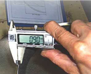 Caliper measuring a root face.