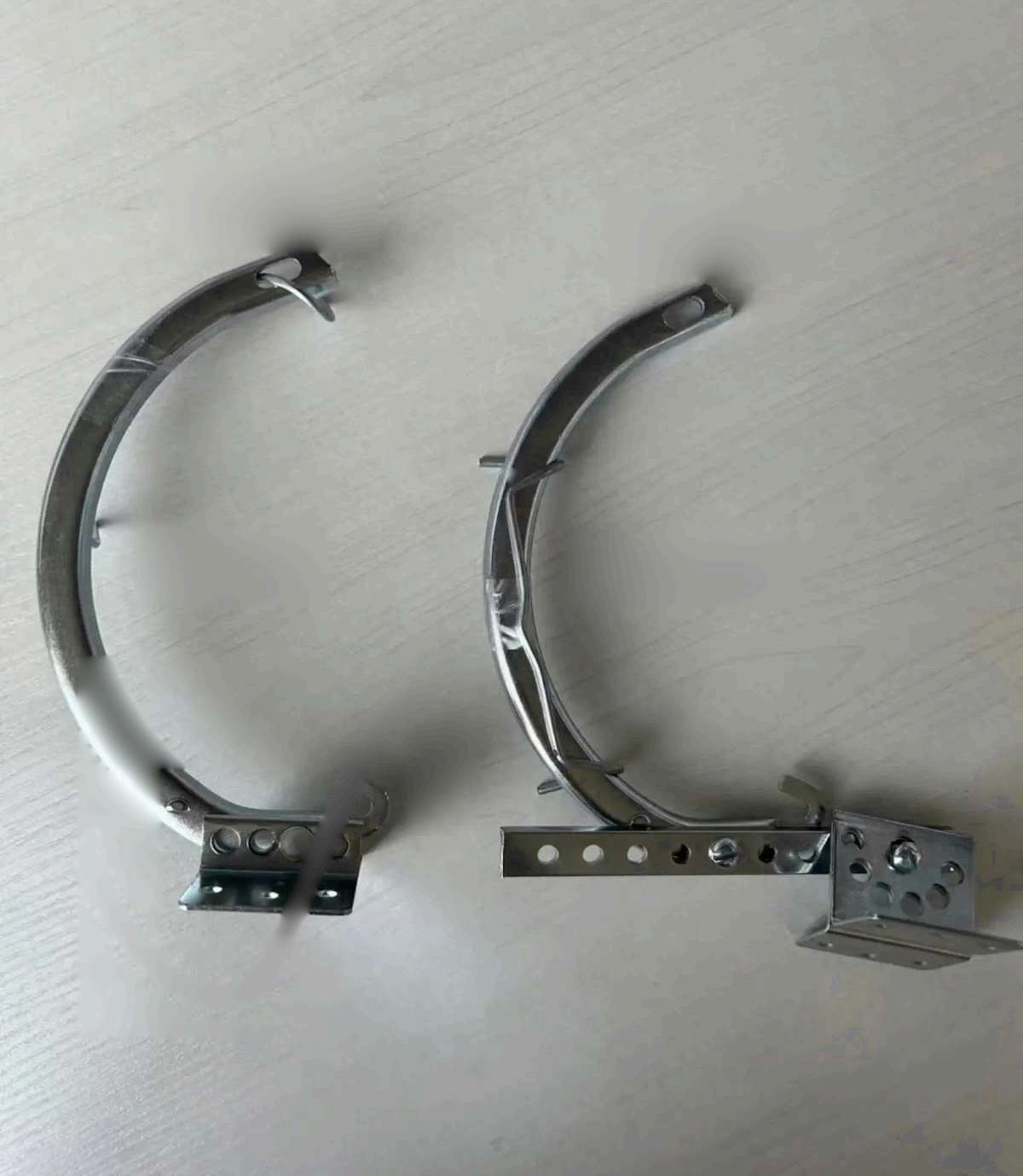 Galvanized 6 inch half round steel brackets, type 1 and type 2.