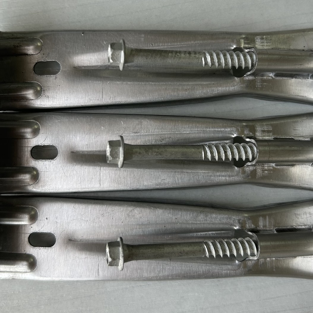 Common profile 5 inch gutter hangers with screws.