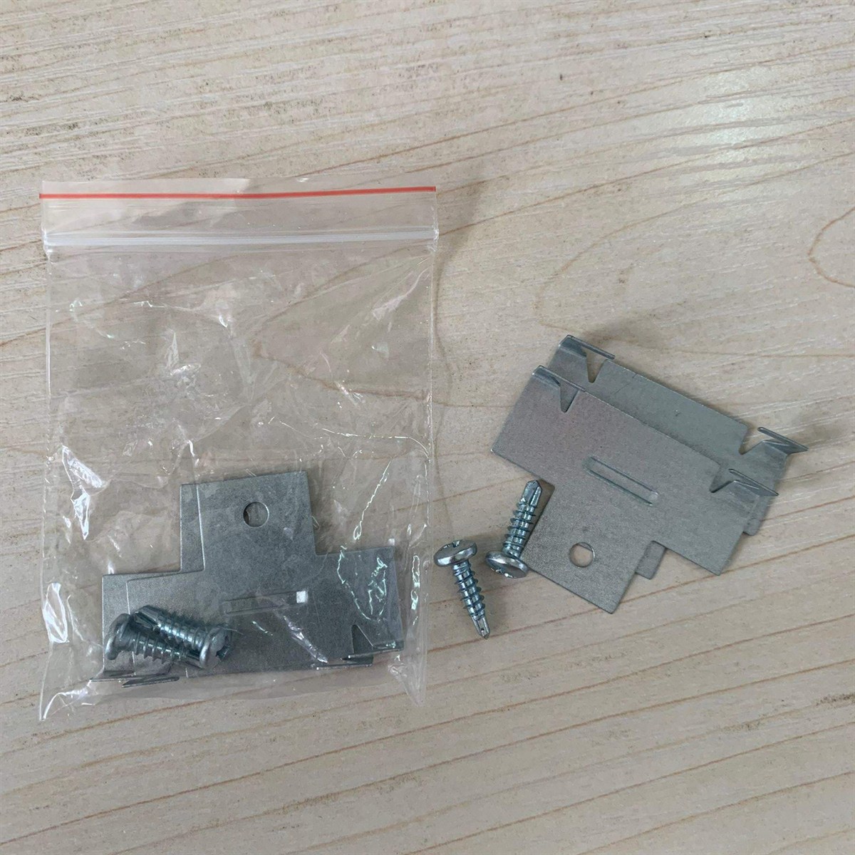 Stainless steel C-clips supplied bagged with self-drilling screws.