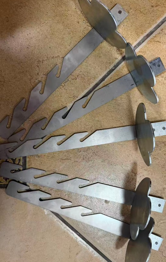 Galvanized steel continuous toothed snow stopper bars.